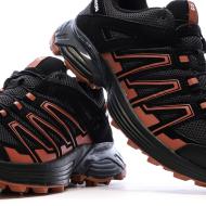 Zapatillas de senderismo negras/naranjas para mujer Salomon Supercross 4 ver 7